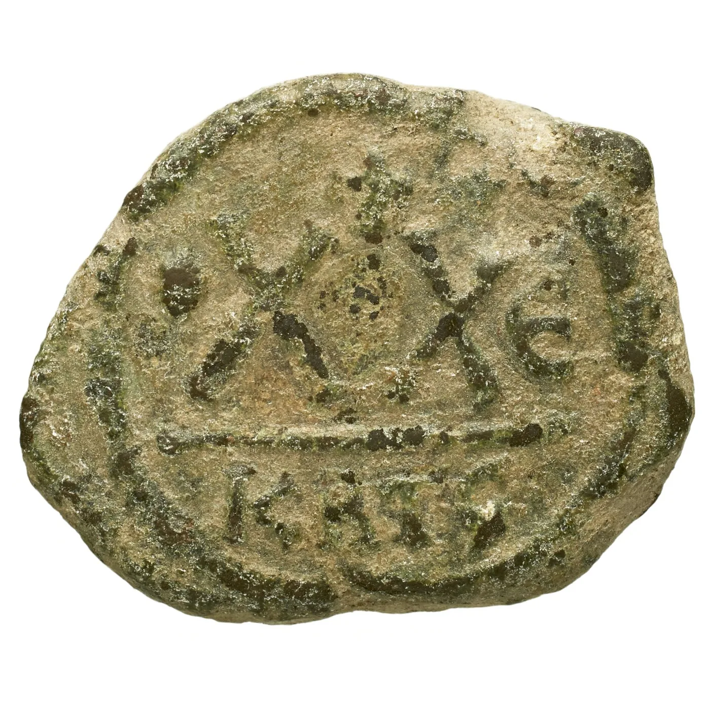 Reverse of a Byzantine copper coin showing two large X characters side by side above a horizontal line, with letters in the strip below