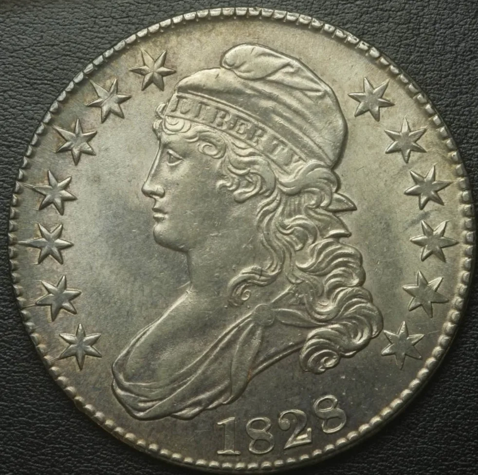 Obverse of an 1828 Capped Bust half dollar showing LIBERTY on the cap band, seven stars left and six right, and the date below the bust