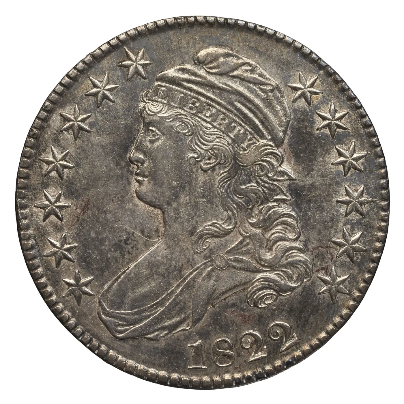 Obverse of an 1822 Capped Bust half dollar photographed against white, with the date and the thirteen surrounding stars clearly separated