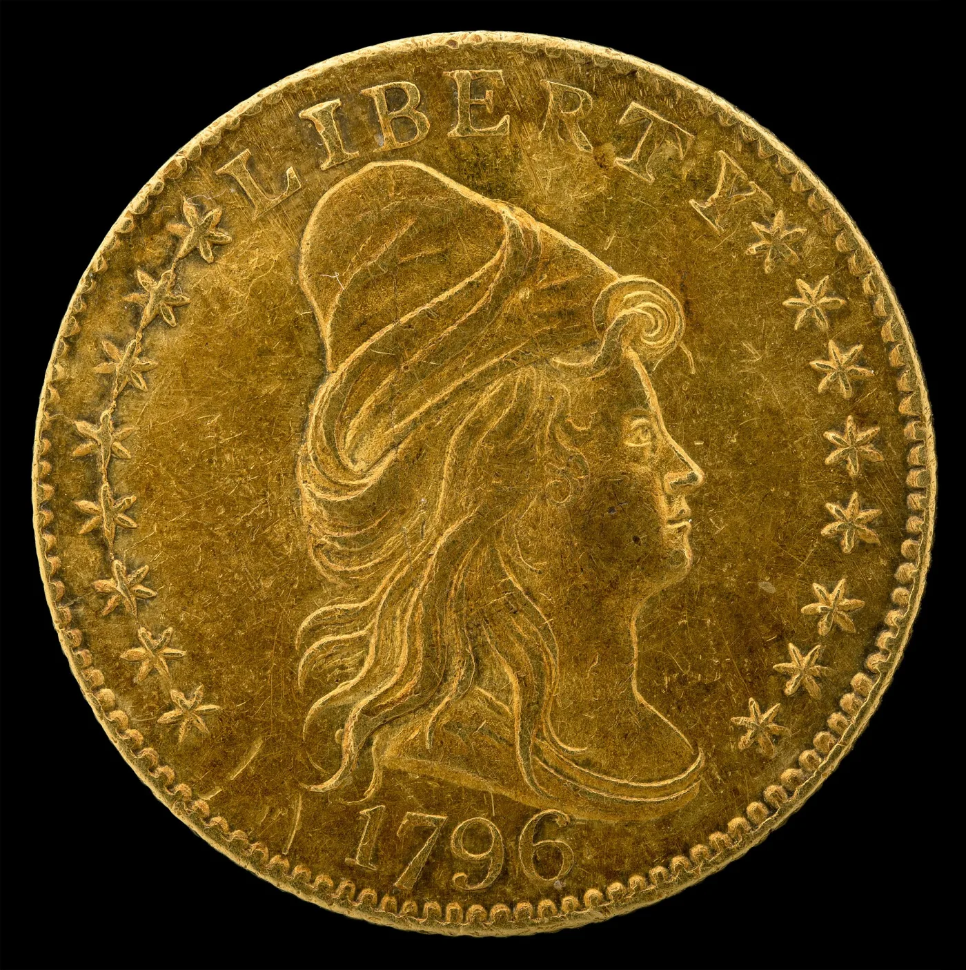 Obverse of an 1796 quarter eagle with a ring of stars around the capped head of Liberty facing right, LIBERTY above and the date 1796 below