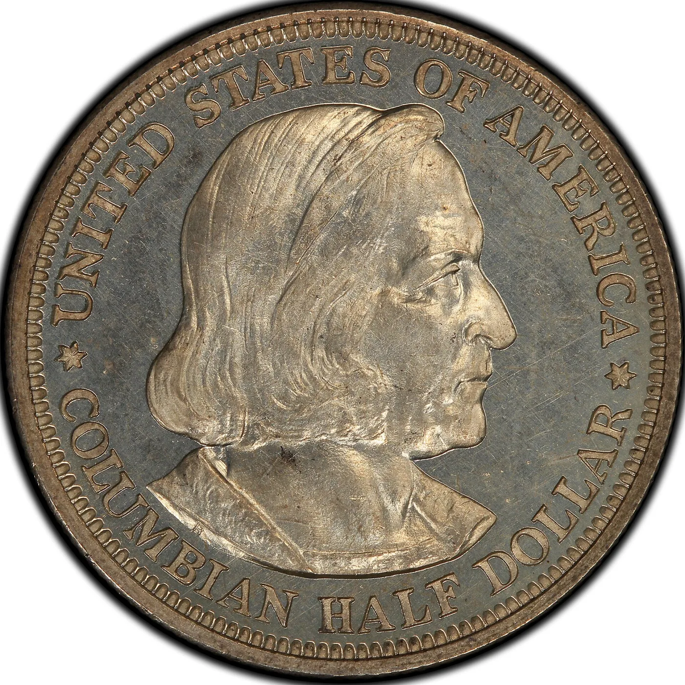 Obverse of an 1892 Columbian half dollar showing a bust of Christopher Columbus with UNITED STATES OF AMERICA above and COLUMBIAN HALF DOLLAR below