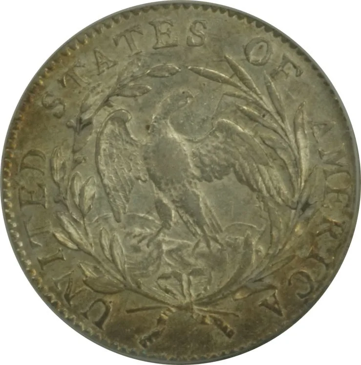 Reverse of a 1796 Draped Bust dime showing a slender eagle with spread wings perched on clouds inside an open wreath, UNITED STATES OF AMERICA around the rim