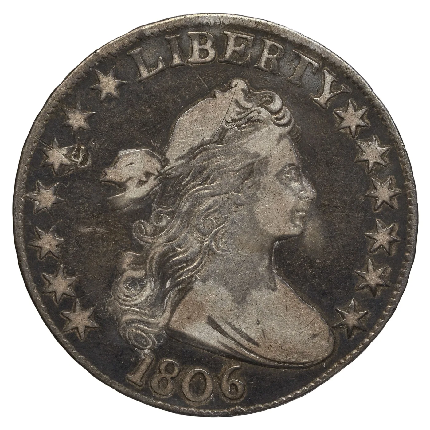 Obverse of an 1806 Draped Bust half dollar showing Liberty facing right with a cloth drape across the bust, LIBERTY arching above and stars around the rim