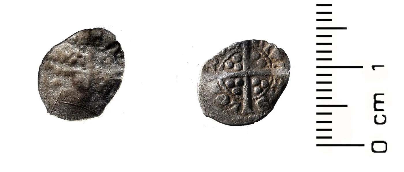 Two faces of a small medieval silver farthing beside a scale, one face struck normally and the other carrying a sunken mirrored impression