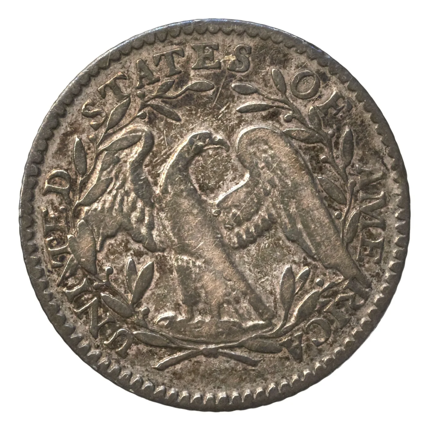 Reverse of a 1794 Flowing Hair half dime with the small eagle and open wreath softly struck toward the rim