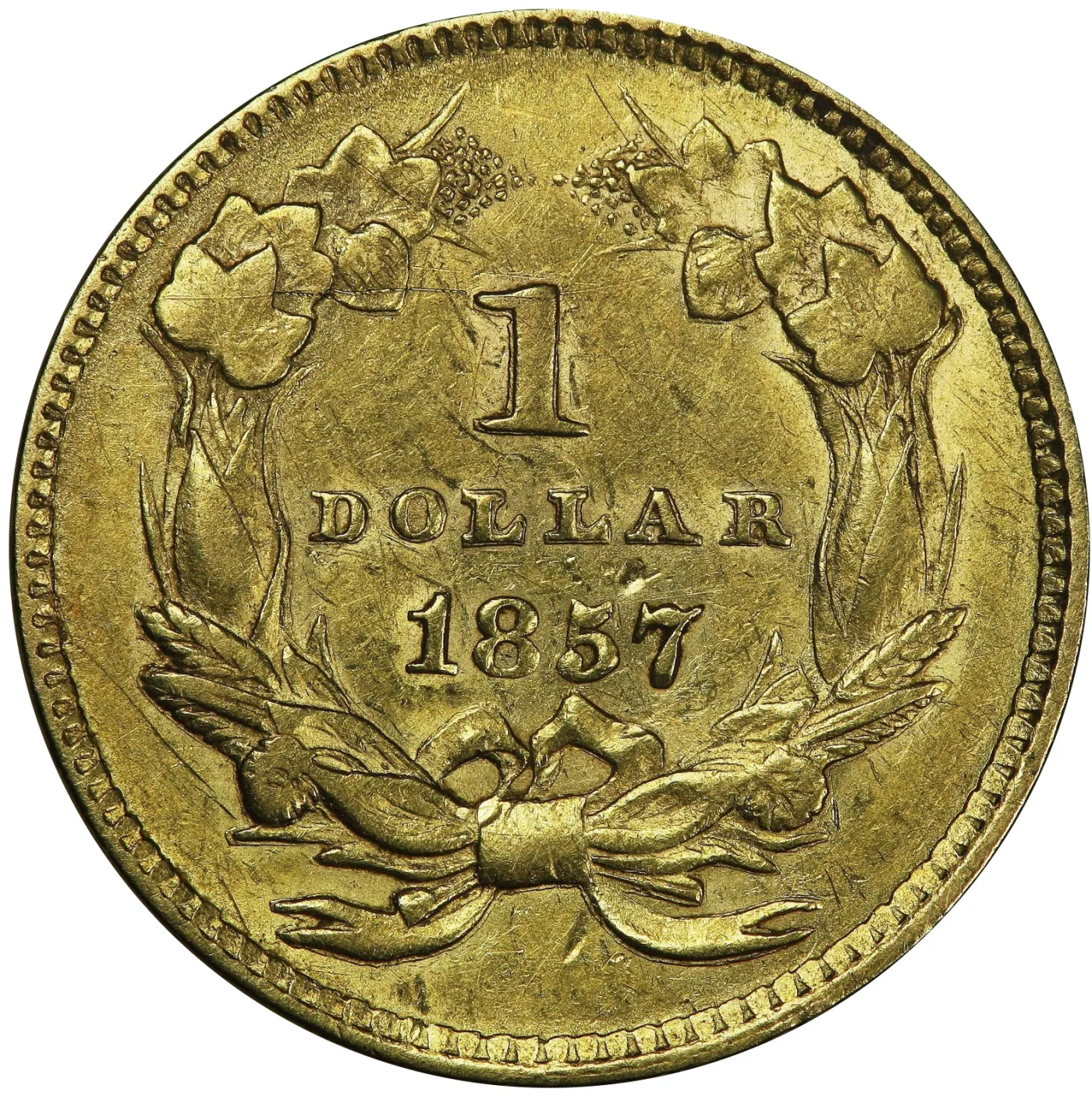 Magnified reverse of an 1857 Type 3 gold dollar, the agricultural wreath enclosing 1 DOLLAR above the date 1857, with the field below the bow empty of any mint mark