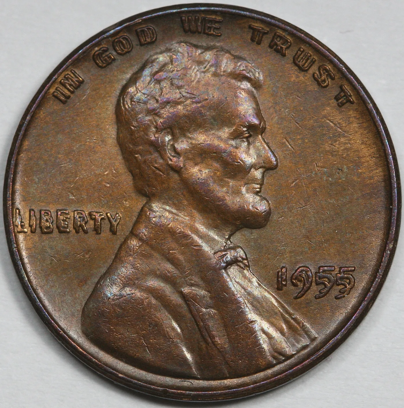 Close view of a 1955 Doubled Die Obverse Lincoln cent showing rounded, fully separated doubling on the motto, LIBERTY and the date