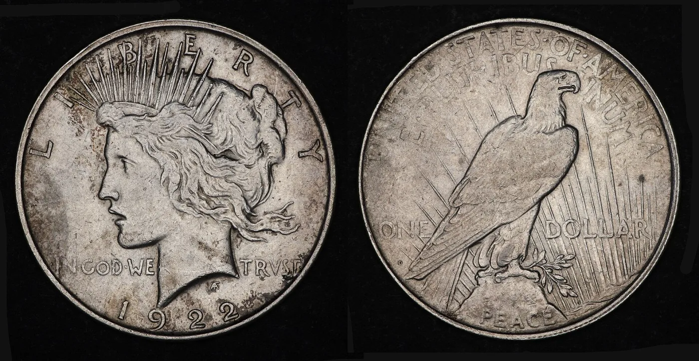 Obverse and reverse of a 1922-D Peace dollar, with a small D punched into the field below ONE and left of the eagle's tail
