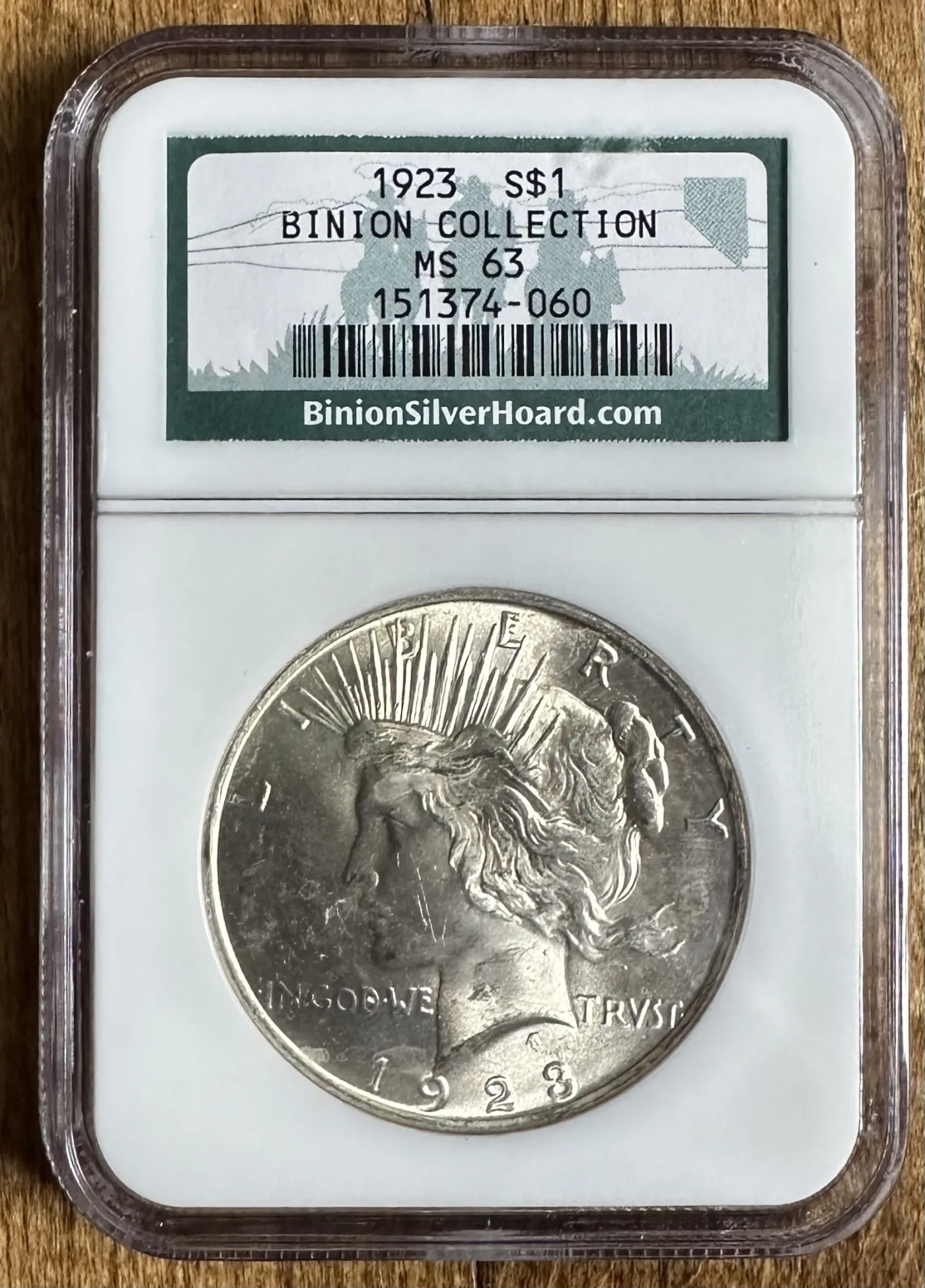 A 1923 Peace dollar sealed in an NGC holder, the label reading 1923 S$1 Binion Collection MS 63 with a barcode and certification number