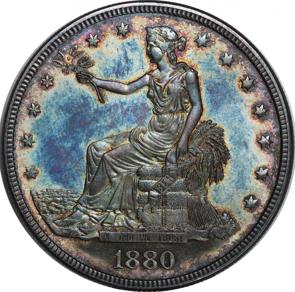 Obverse of an 1880 proof Trade Dollar with deep blue and gold toning across mirrored fields and frosted devices